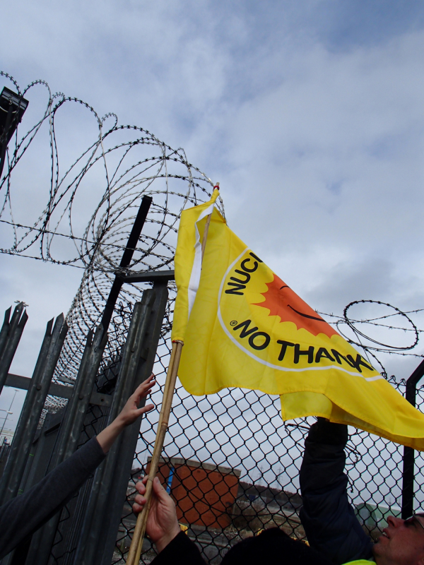 Yellow flag and barbed wire.  Photo credit / copyright: Marianne Birkby.