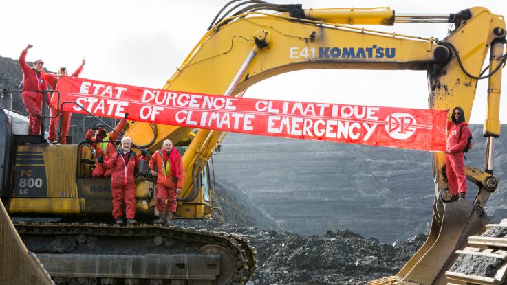 Activist in the UK occupy a digger in a coal mine