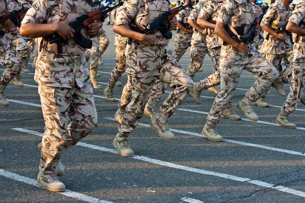 Saudi military personnel marching.