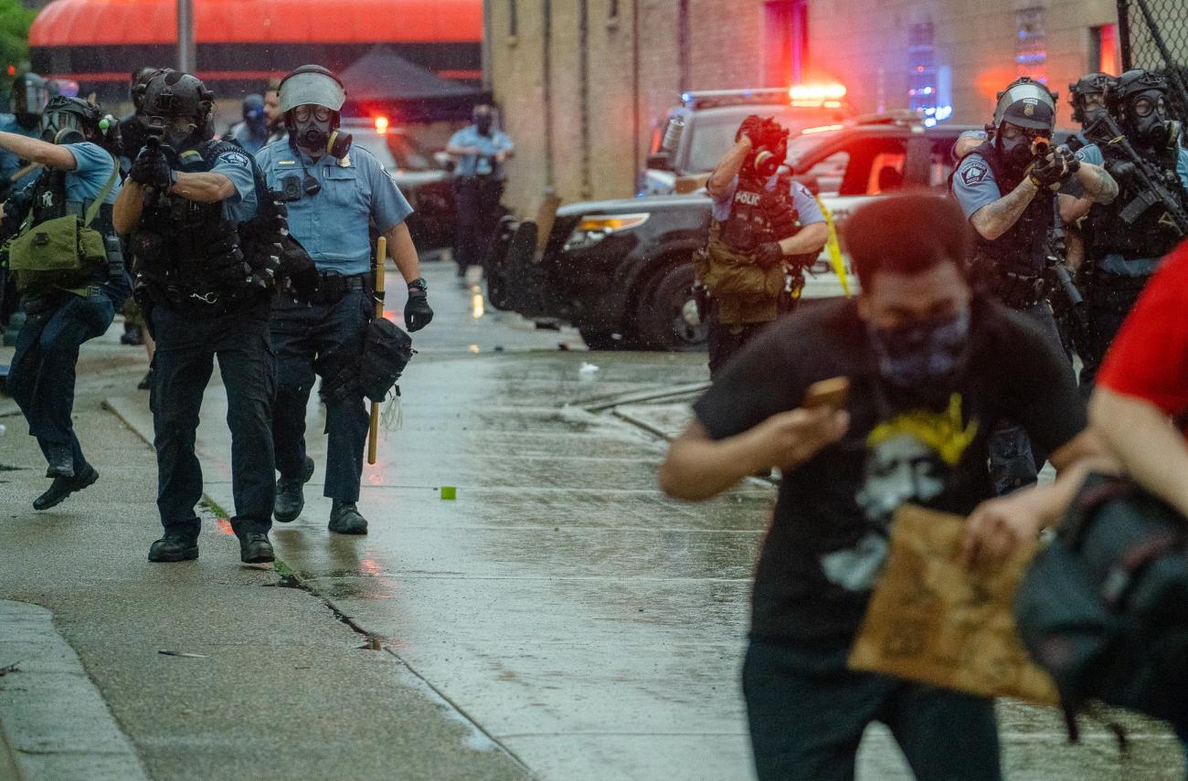   Minneapolis Police fire tear gas at those protesting the May 25th death of George Floyd.