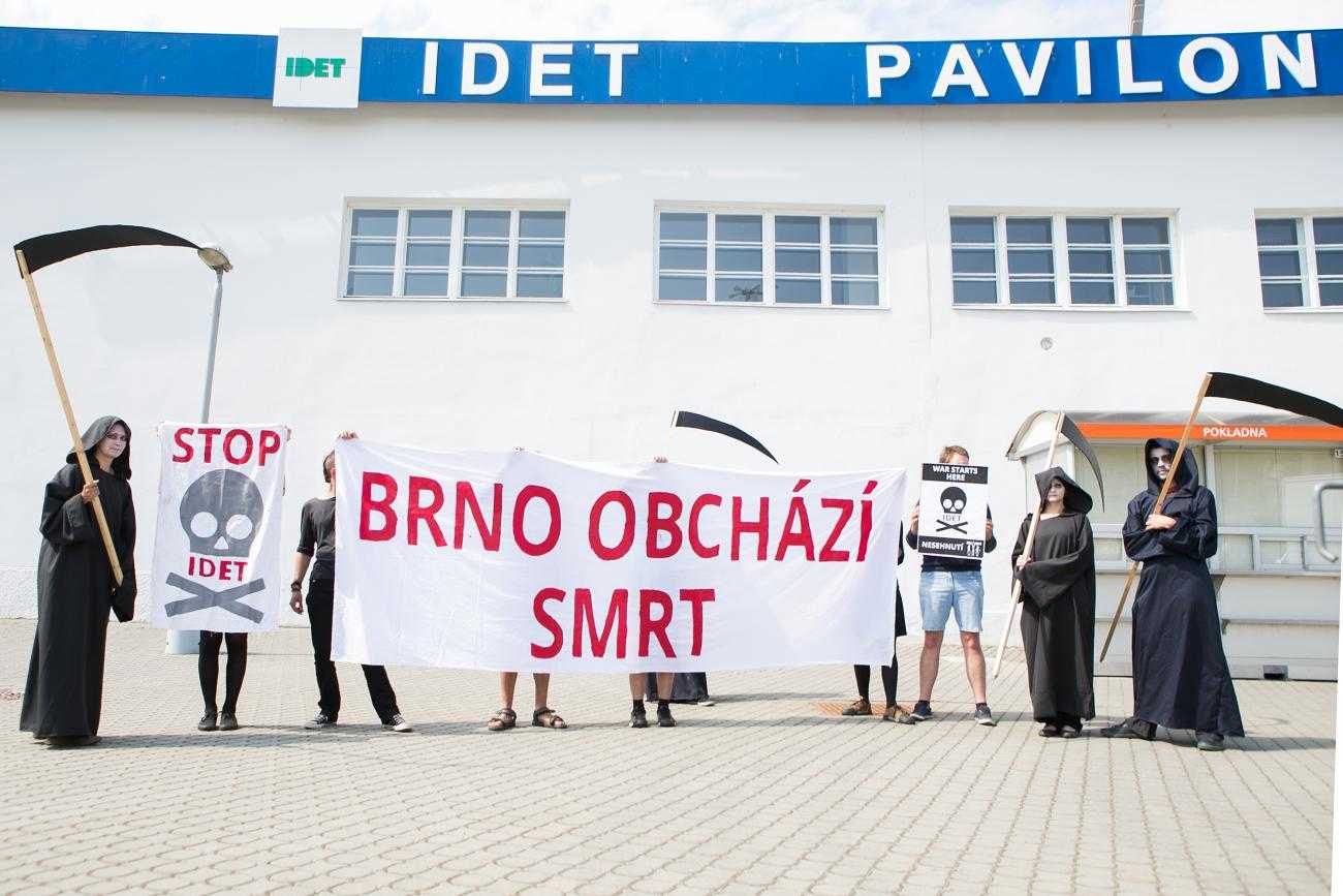 Protesters and 'death' gather outside the IDET arms fair in Brno, 2015
