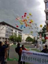 Balloons released at a International Conscientious Objectors Day protests