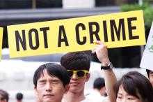 "Not a Crime" sign. Prisoners for Peace day