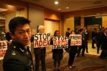 Activists from Germany, West Papua and South Korea disrupt the welcome dinner at the ADEX arms fair