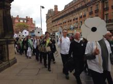Sheffield peace choir processing through the city