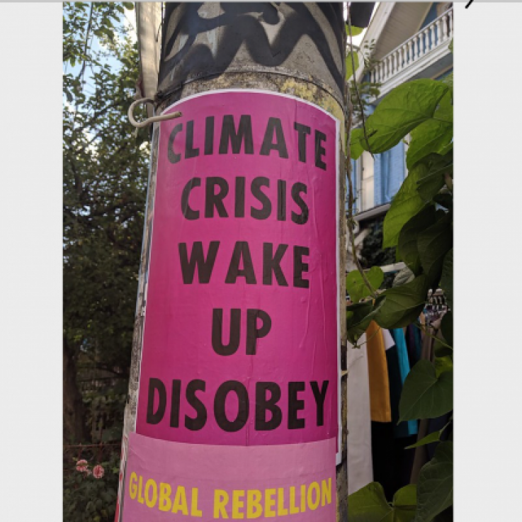 Street art from Toronto: Climate Crisis Wake Up Disobey sign